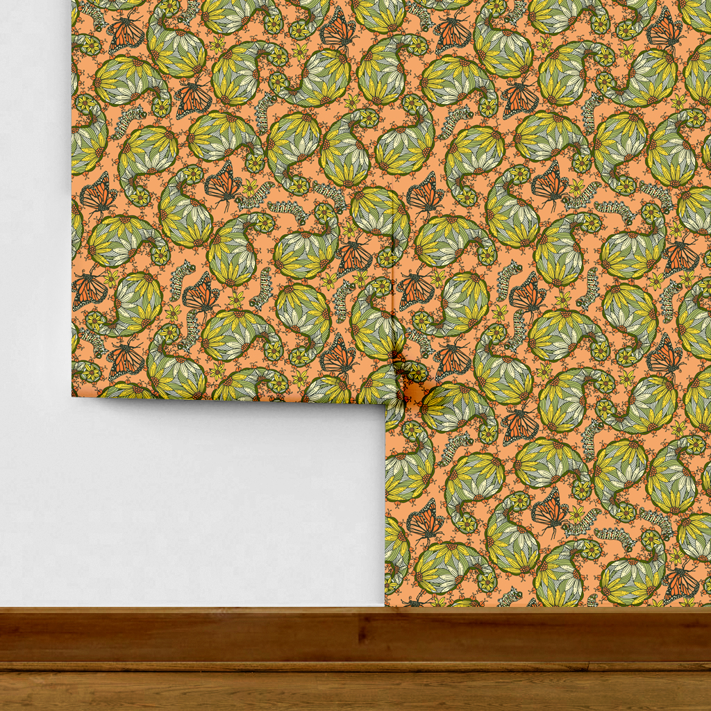 The artwork features a dense, seamless pattern composed of intricately detailed butterflies, caterpillars, and flowers. The butterflies are primarily orange with black and white accents, conveying a monarch butterfly design. The caterpillars are segmented and textured with earthy tones of green and beige, blending naturally with the floral elements. The flowers have petals colored in shades of pale pink and green, with leaves interspersed throughout the composition. The background is a light, muted yellow, which enhances the vibrant colors of the butterflies and floral motifs. The overall design is highly decorative and organic, showcasing a lyrical interplay between the stages of a butterfly's life cycle and plant life. 